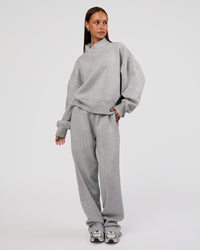 Woman wearing MVP 1/2 Zip Oversized Sweater - Light Grey Marl | Model:Brylee | Size:S