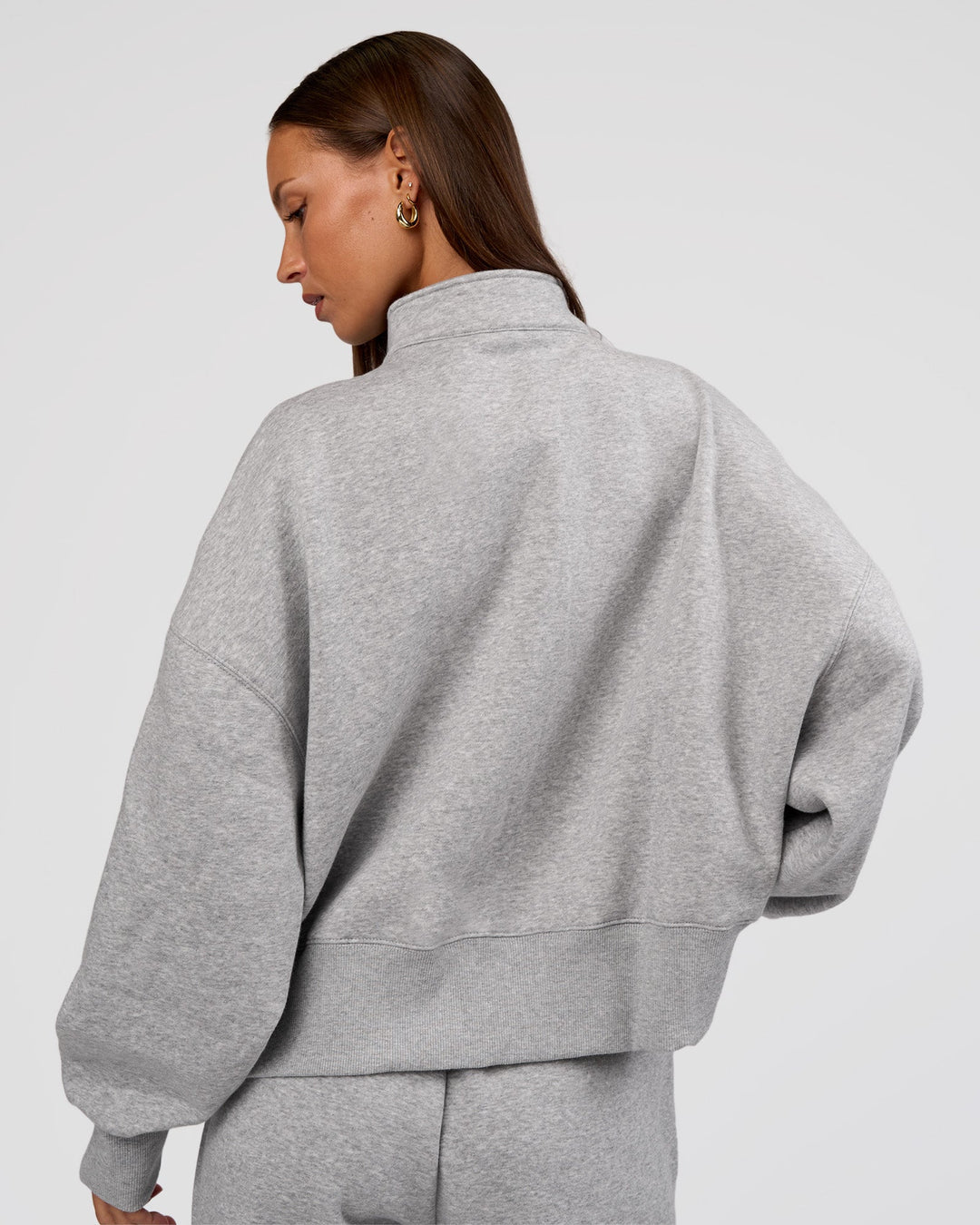 Woman wearing MVP 1/2 Zip Oversized Sweater - Light Grey Marl | Model:Brylee | Size:S