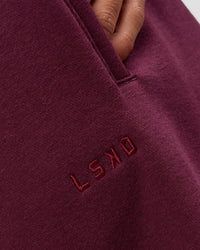 Woman wearing MVP Oversized Slouchy Fit Track Pant - Cherry Lacquer | Model:Brylee | Size:S