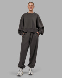 Woman wearing MVP Oversized Slouchy Fit Track Pant - Dark Storm | Model:Neve | Size:S