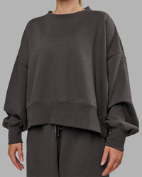 Woman wearing MVP Oversized Sweater - Dark Storm | Model:Neve | Size:S