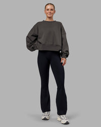 Woman wearing MVP Oversized Sweater - Dark Storm | Model:Neve | Size:S