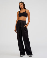 Woman wearing MVP Wide Leg Tall Track Pant - Black | Model:Ruby | Size:S