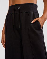 Woman wearing MVP Wide Leg Tall Track Pant - Black | Model:Ruby | Size:S