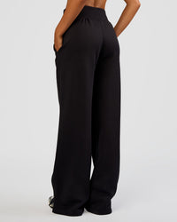 Woman wearing MVP Wide Leg Tall Track Pant - Black | Model:Ruby | Size:S