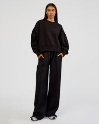 Woman wearing MVP Wide Leg Tall Track Pant - Black | Model:Ruby | Size:S