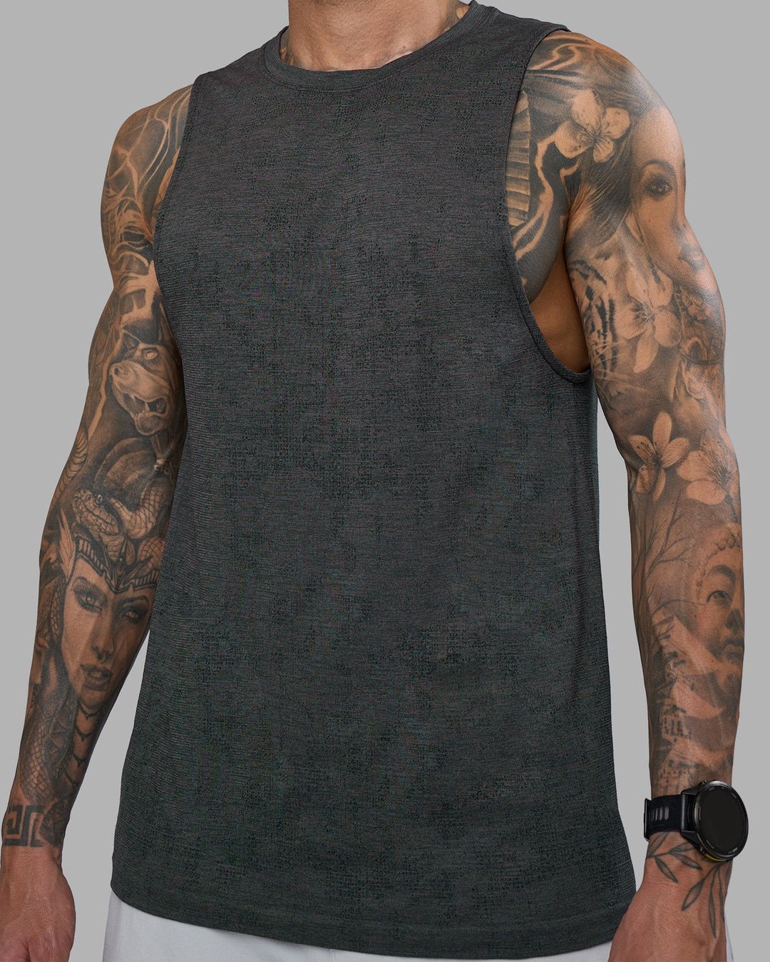 Man wearing AeroFLX+ Seamless Muscle Tank - Black Camo-Graphite | Model:Tommy | Size:S