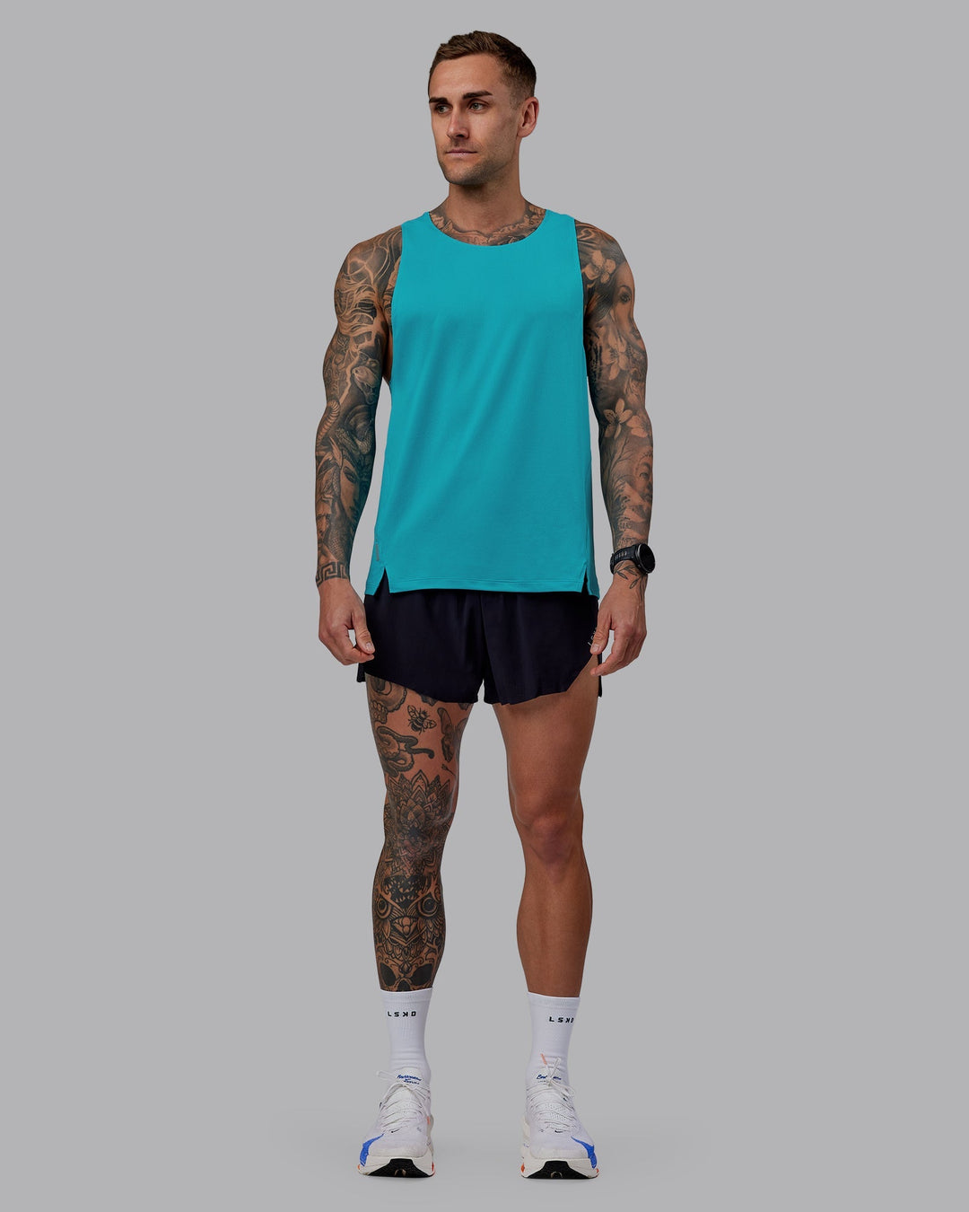 Man wearing Pace Running Tank - Blue Bird