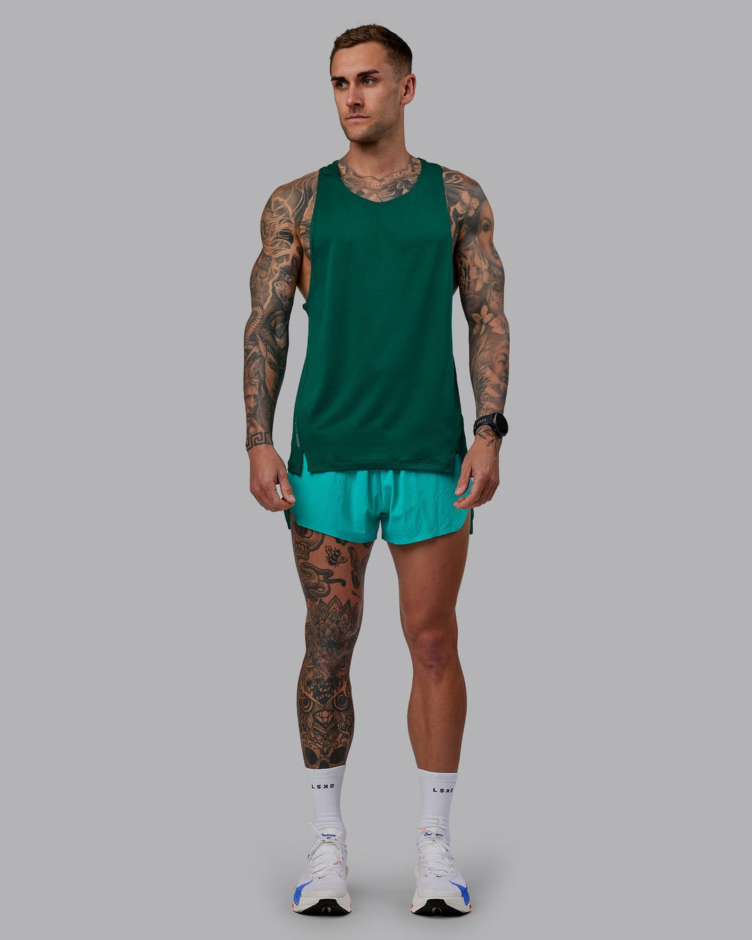 Man wearing Pace Running Tank - Malachite