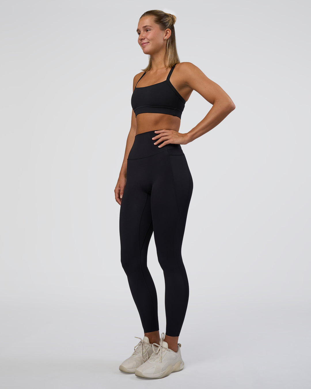 Woman wearing Momentum Sports Bra - Black | Model:Amity | Size:S