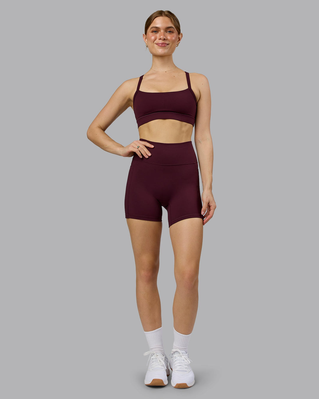 Woman wearing Momentum Sports Bra - Cherry Lacquer | Model:Emilie | Size:S - view 4