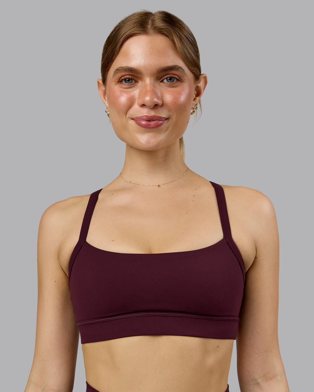Woman wearing Momentum Sports Bra - Cherry Lacquer | Model:Emilie | Size:S - view 2