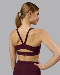 Woman wearing Momentum Sports Bra - Cherry Lacquer | Model:Emilie | Size:S | Thumbnail Index: 5