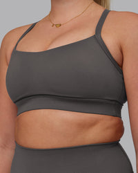 Woman wearing Momentum Sports Bra D/DD/E - Dark Storm | Model:Lilli | Size:S