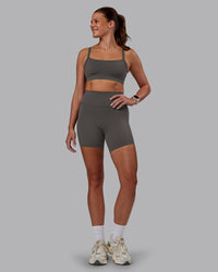 Woman wearing Momentum Sports Bra - Dark Storm | Model:Phoebe | Size:S