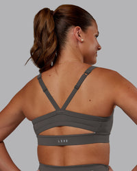 Woman wearing Momentum Sports Bra - Dark Storm | Model:Phoebe | Size:S