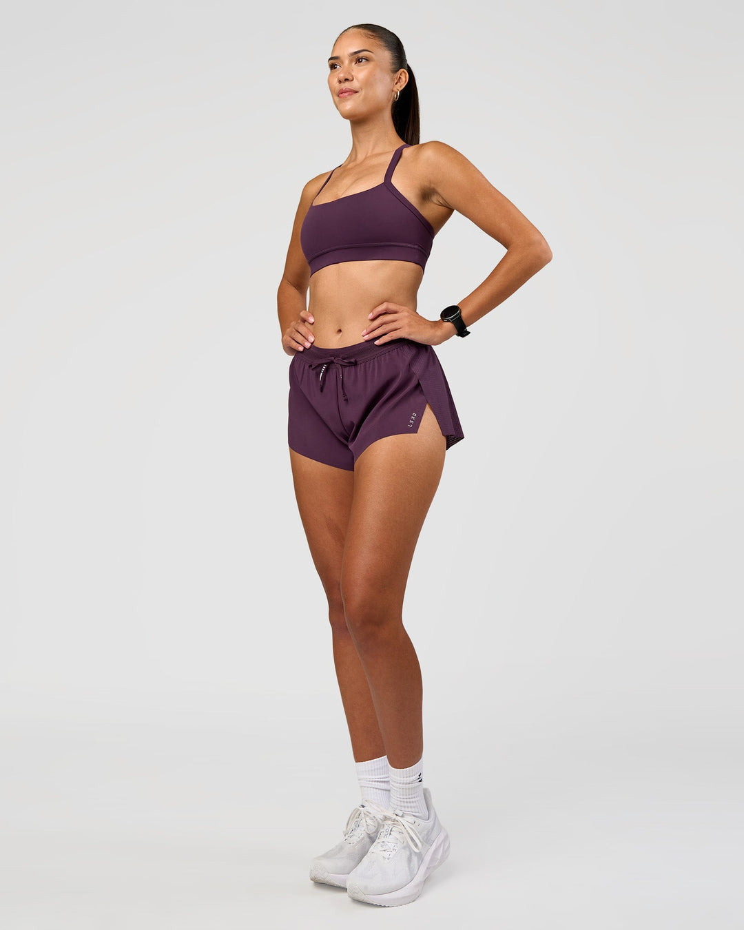 Woman wearing Momentum Sports Bra - Midnight Plum | Model:Rhiley | Size:S