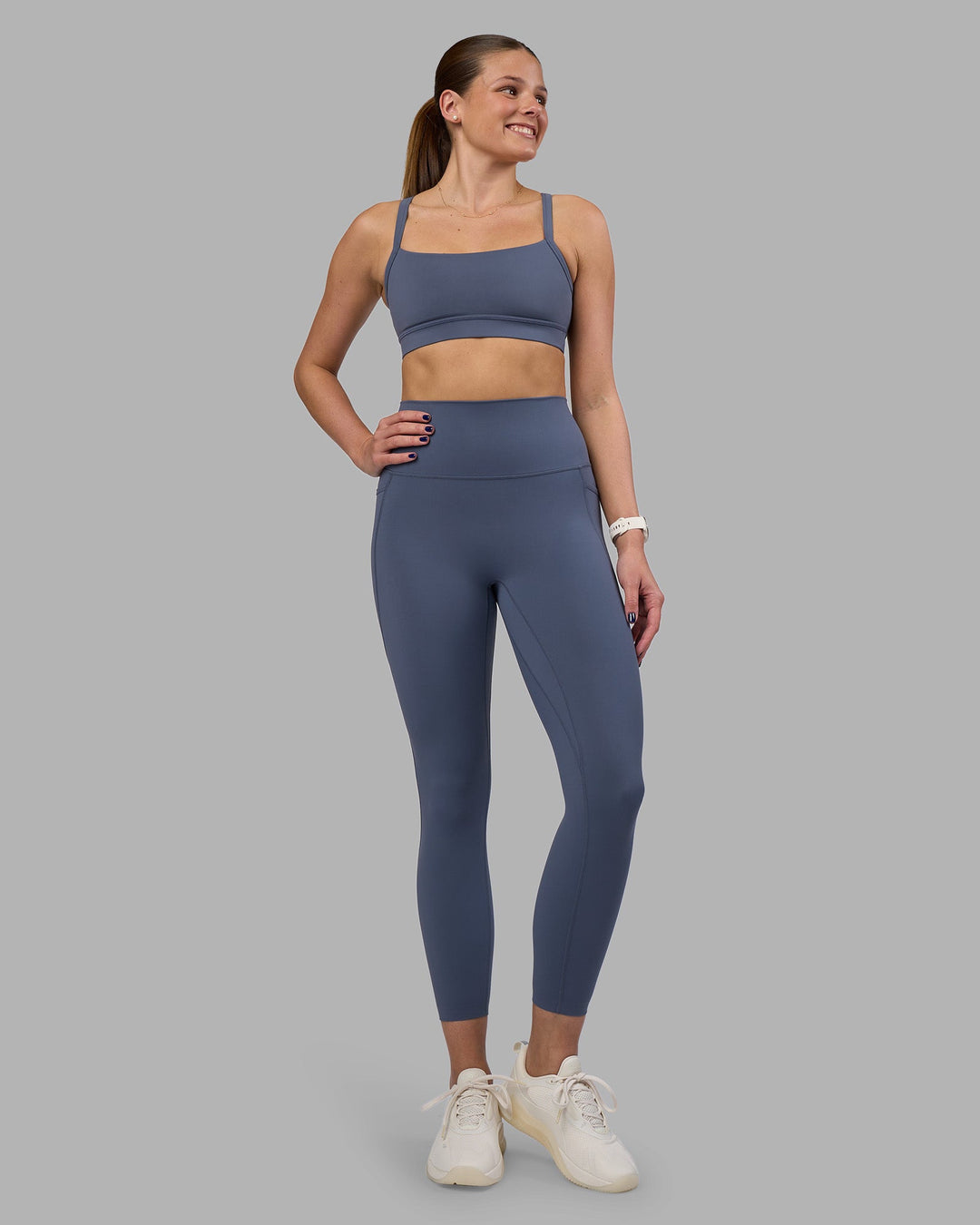 Woman wearing Momentum Sports Bra - Night Shadow | Model:Phoebe | Size:S