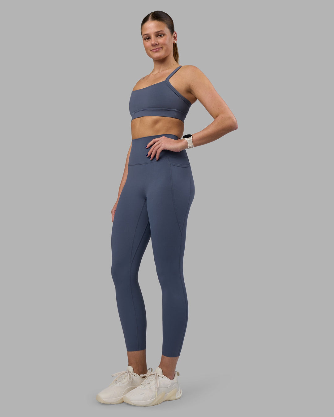 Woman wearing Momentum Sports Bra - Night Shadow | Model:Phoebe | Size:S