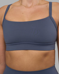 Woman wearing Momentum Sports Bra - Night Shadow | Model:Phoebe | Size:S