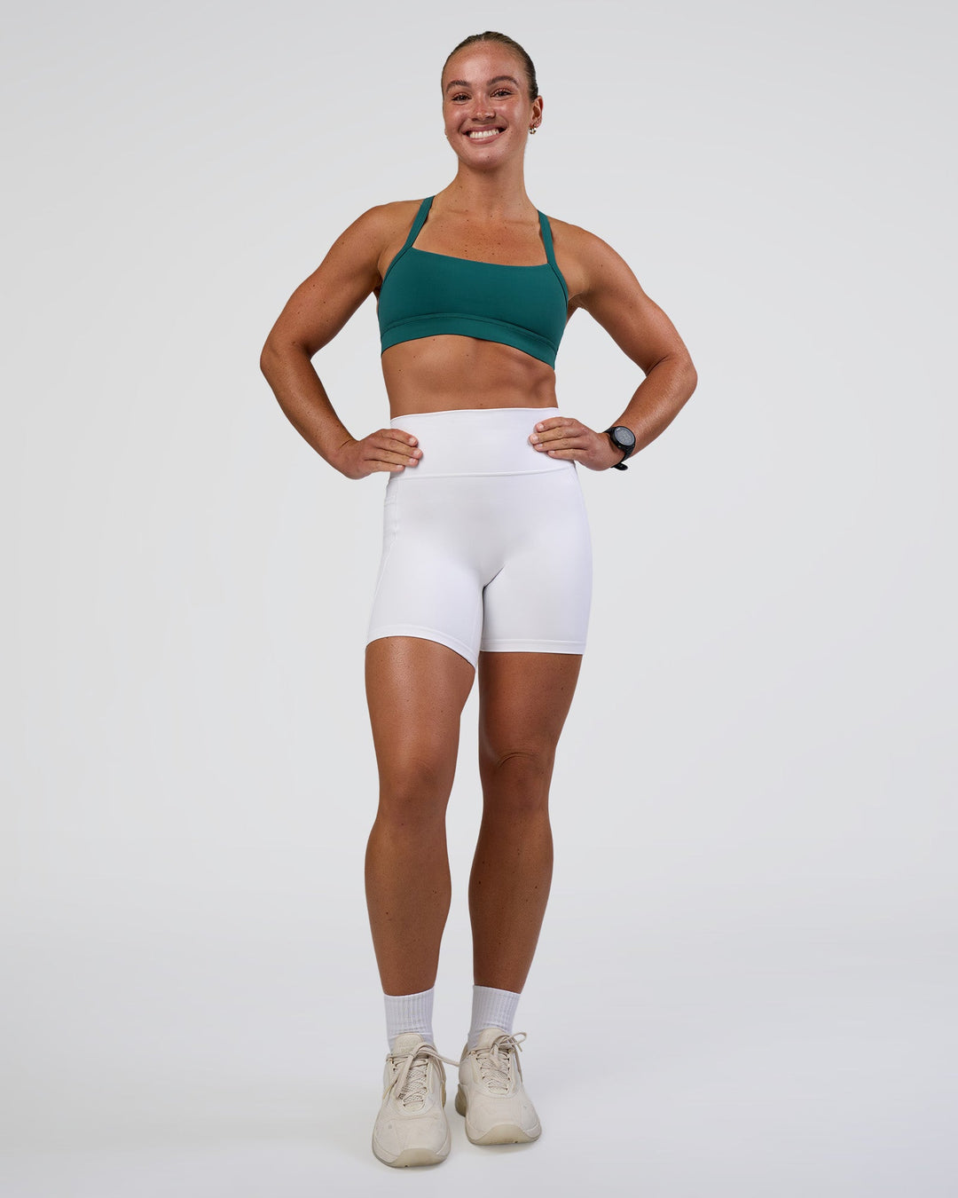 Woman wearing Momentum Sports Bra - Transformative Teal | Model:Sav | Size:S