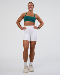 Woman wearing Momentum Sports Bra - Transformative Teal | Model:Sav | Size:S