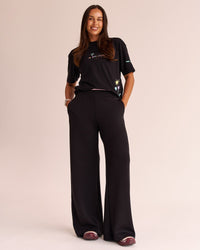 Woman wearing Mother's Day FLXCotton Oversize Tee - Black | Model:Jess | Size:S
