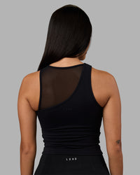 Woman wearing Motion Mesh Shelf Bra Tank - Black | Model:Rhiley | Size:S