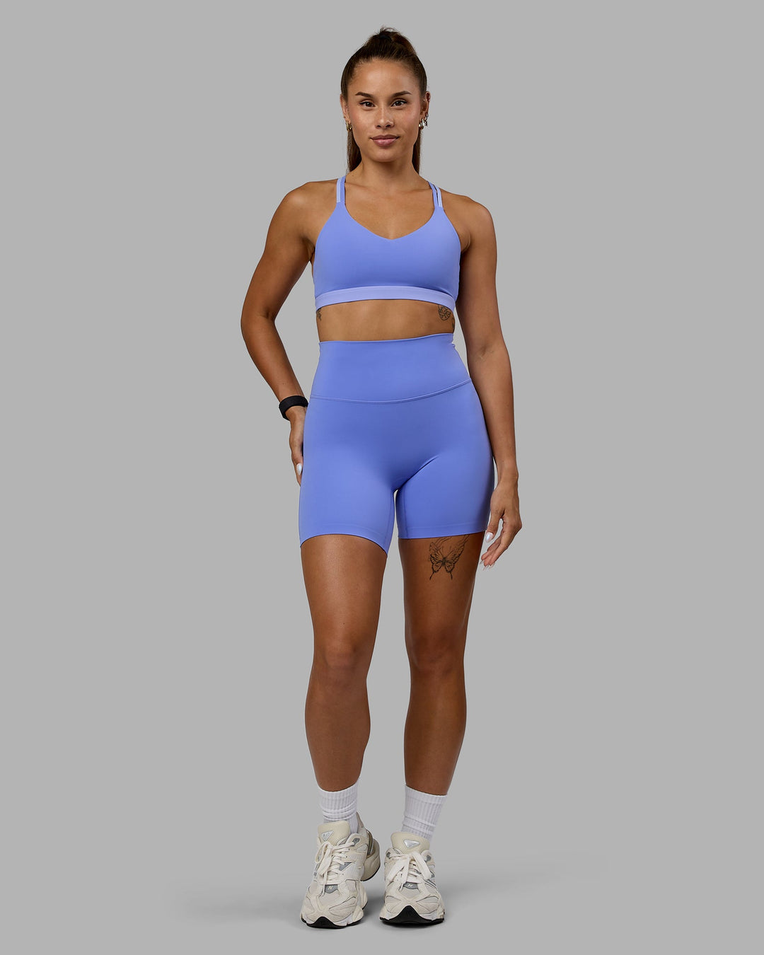 Woman wearing Nexus Sports Bra - Indulgent Blue