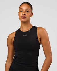 Woman wearing NyxRun Stash Tank - Black | Model:Rosie | Size:S