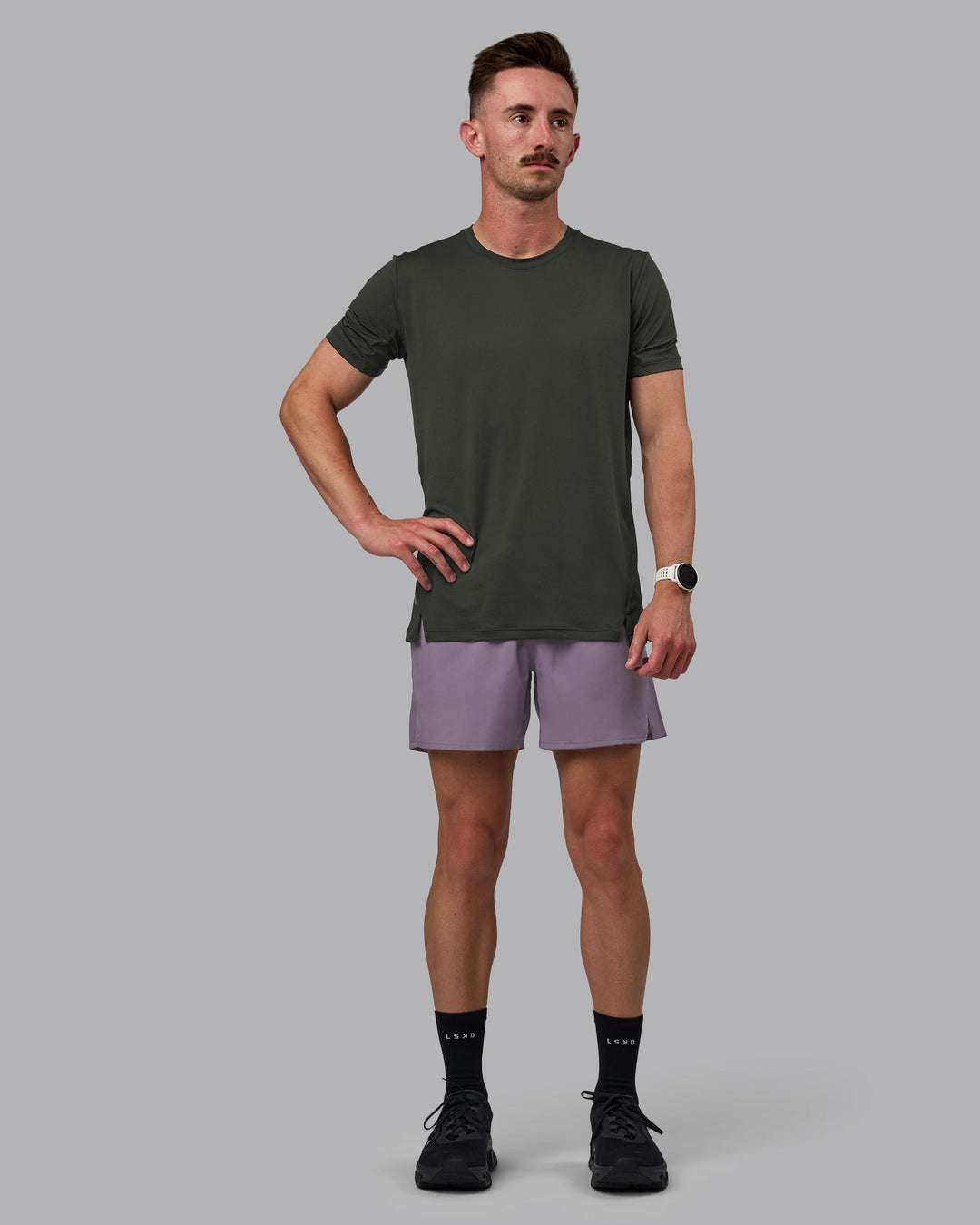 Man wearing Pace 5&quot; Lined Performance Shorts - Purple Sage