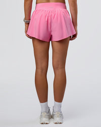 Woman wearing Pacer 3" Run Short - Candy Pink | Model:Emelia | Size:S