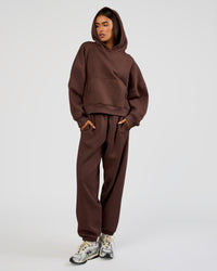 Woman wearing Post Train Hoodie - Hot Chocolate | Model:Ruby | Size:S