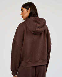 Woman wearing Post Train Hoodie - Hot Chocolate | Model:Ruby | Size:S
