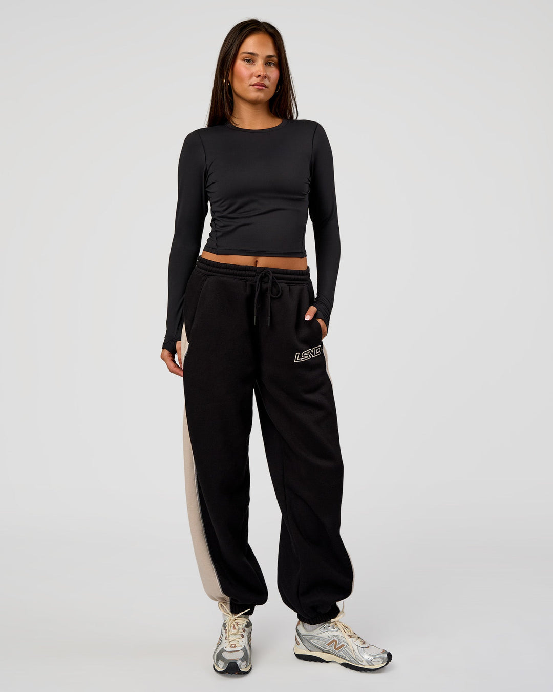 Woman wearing Power Play Stitch Up Fleece Sweat Pant - Black-Shale Beige | Model:Bianca | Size:S
