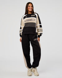 Woman wearing Power Play Stitch Up Fleece Sweat Pant - Black-Shale Beige | Model:Bianca | Size:S