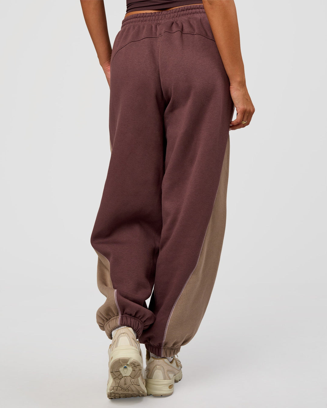 Woman wearing Power Play Stitch Up Fleece Sweat Pant - Cocoa Powder-Marshmallow | Model:Bianca | Size:S