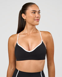 Woman wearing Power Sweetheart Sports Bra - Black | Model:Rhiley | Size:S