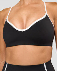 Woman wearing Power Sweetheart Sports Bra - Black | Model:Rhiley | Size:S