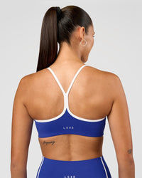 Woman wearing Power Sweetheart Sports Bra - Electric Indigo | Model:Charli | Size:XS