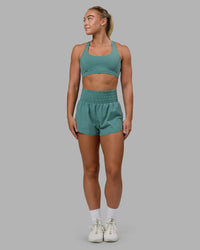 Woman wearing Power Train 2" Shorts - Sagebrush