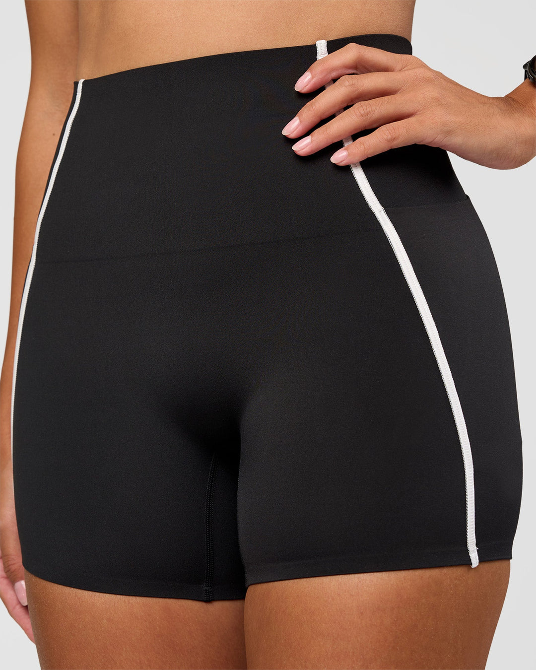 Woman wearing Power Ultra High-Rise 4" Short Pockets - Black | Model:Rhiley | Size:S