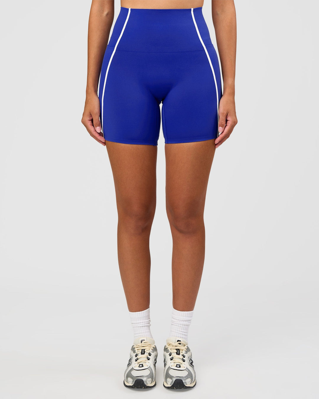 Woman wearing Power Ultra High-Rise 6" Short - Electric Indigo | Model:Rhiley | Size:S