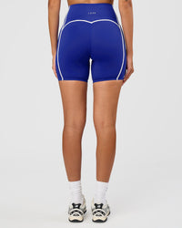 Woman wearing Power Ultra High-Rise 6" Short - Electric Indigo | Model:Rhiley | Size:S