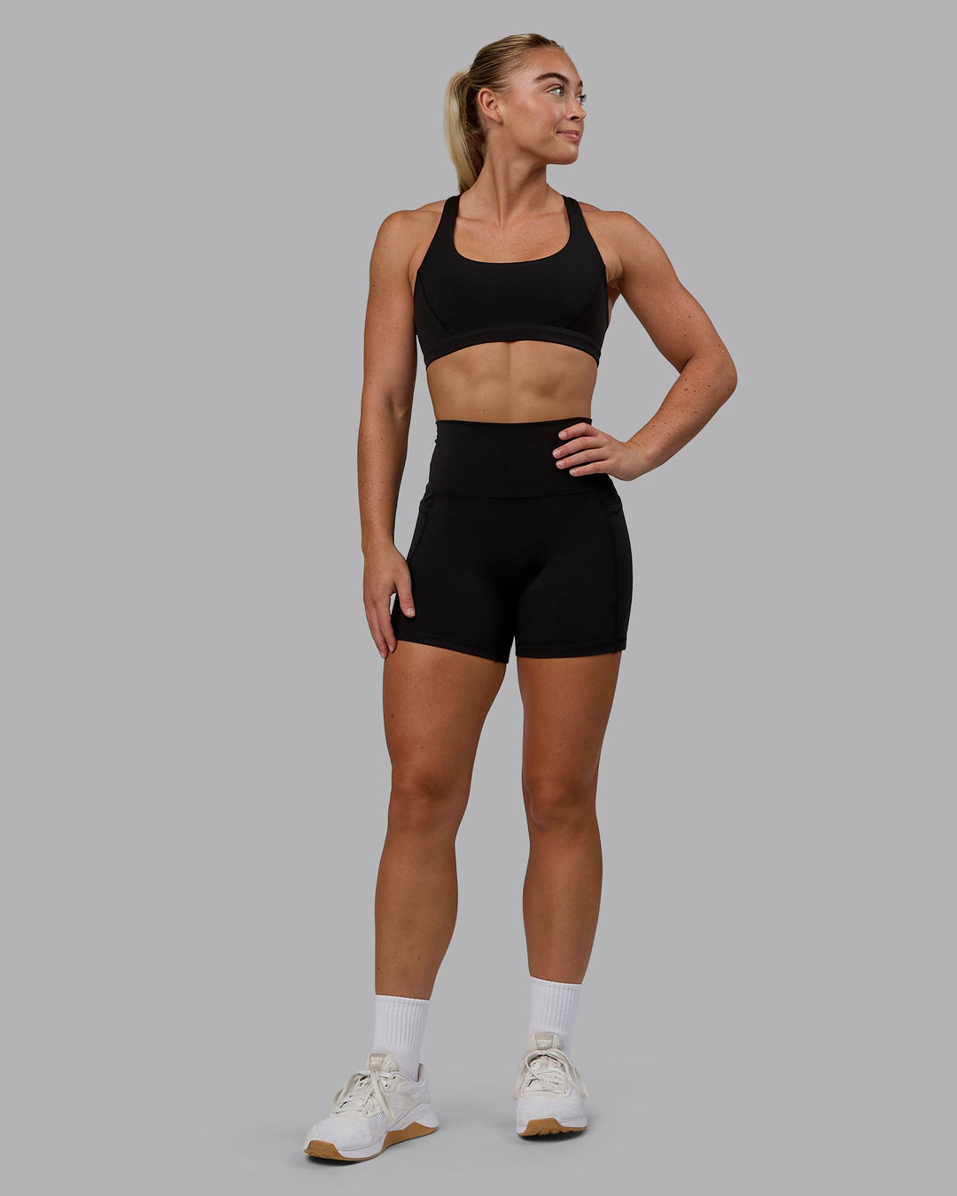 Woman wearing Precision Sports Bra - Black