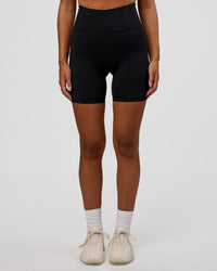 Woman wearing Progression Ultra High-Rise 6" Short - Black | Model:Kirstyn | Size:S