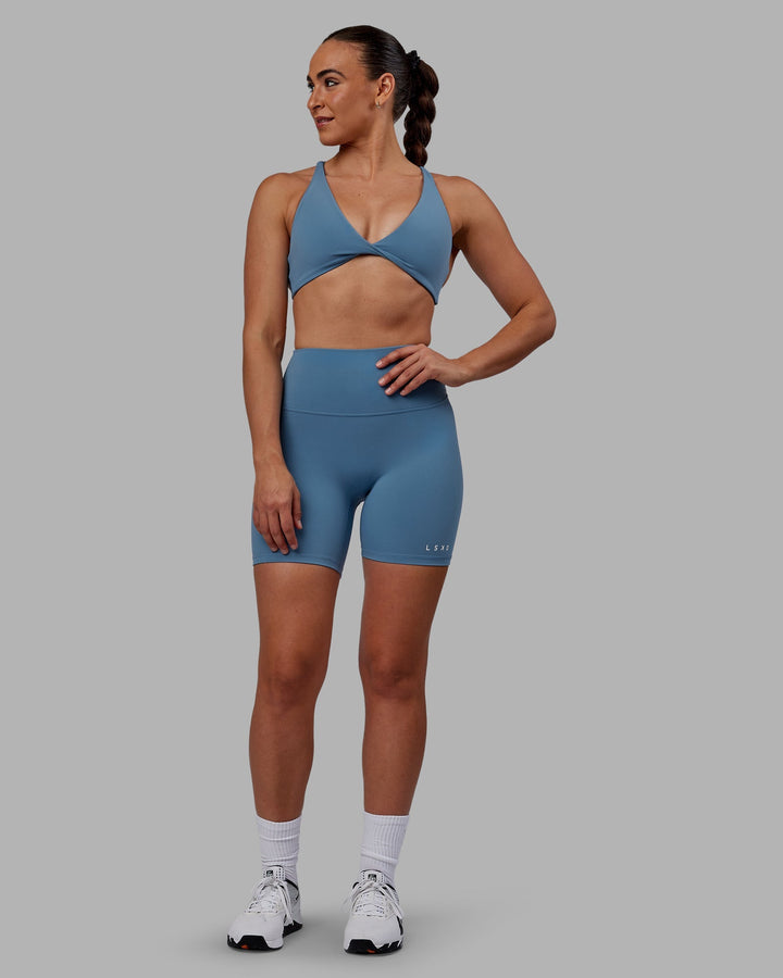 Woman wearing RXD High Waist Mid-Length Shorts - Elemental Blue
