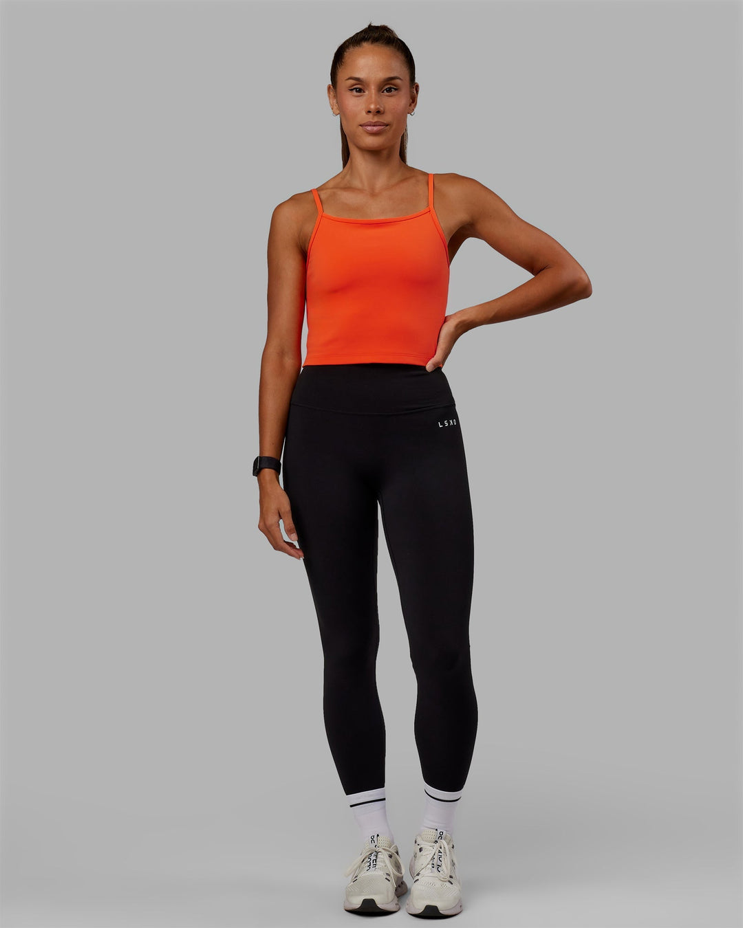 Woman wearing Rapid Active Tank - Ultra Orange