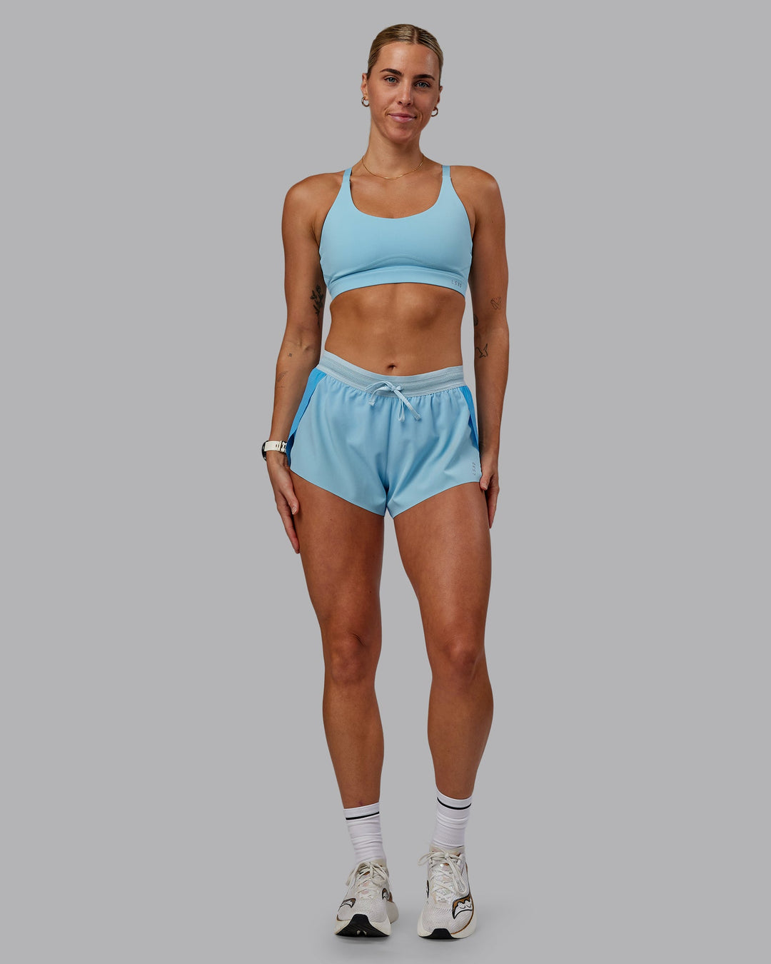 Woman wearing Rapid Sports Bra - Sky Blue