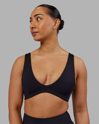 Woman wearing Reform Sports Bra - Black | Model:Ayla | Size:S